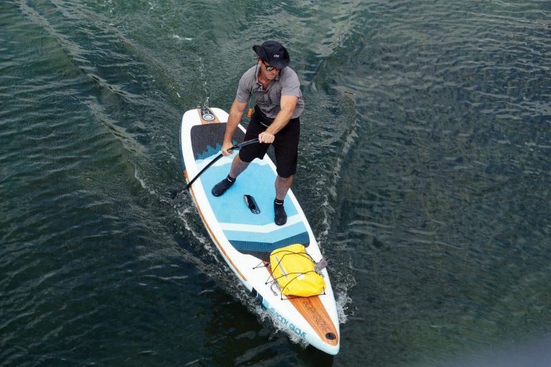 Man with had on paddle board