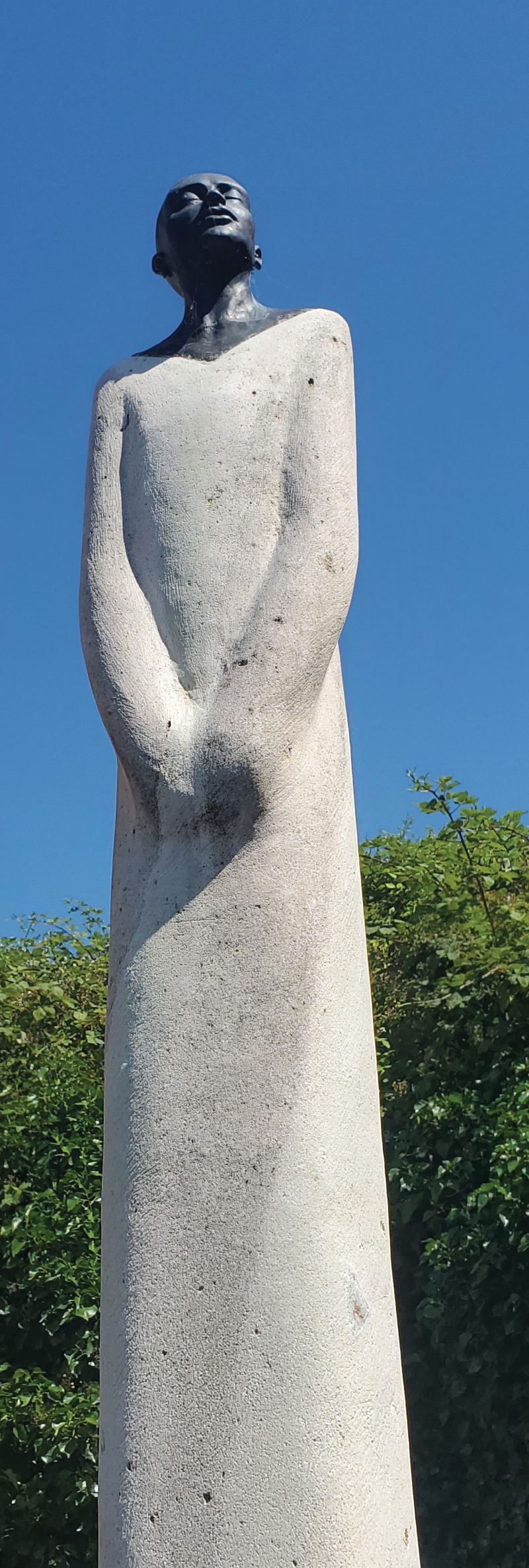 Tall stone statue of a woman