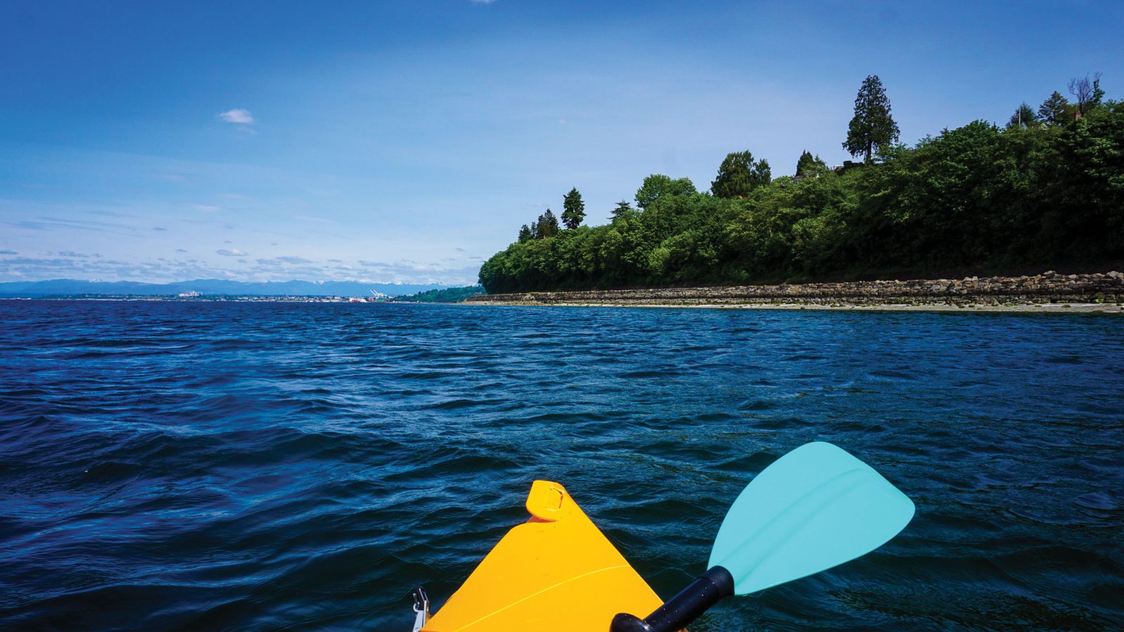 Yellow tip of canoe out on water