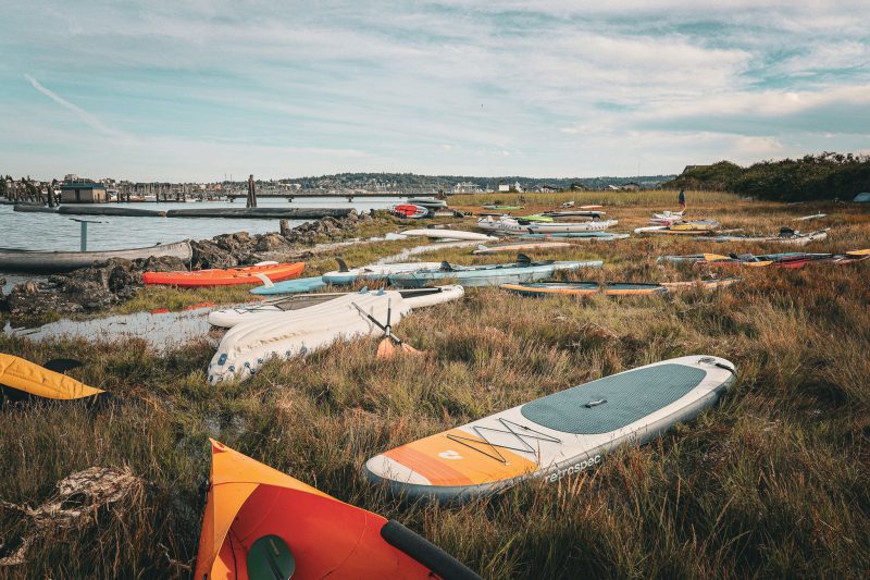 kayaks and boats ashore ready to launch
