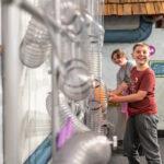 Little boy experiments with air movement at Imagine Chidrens Museum