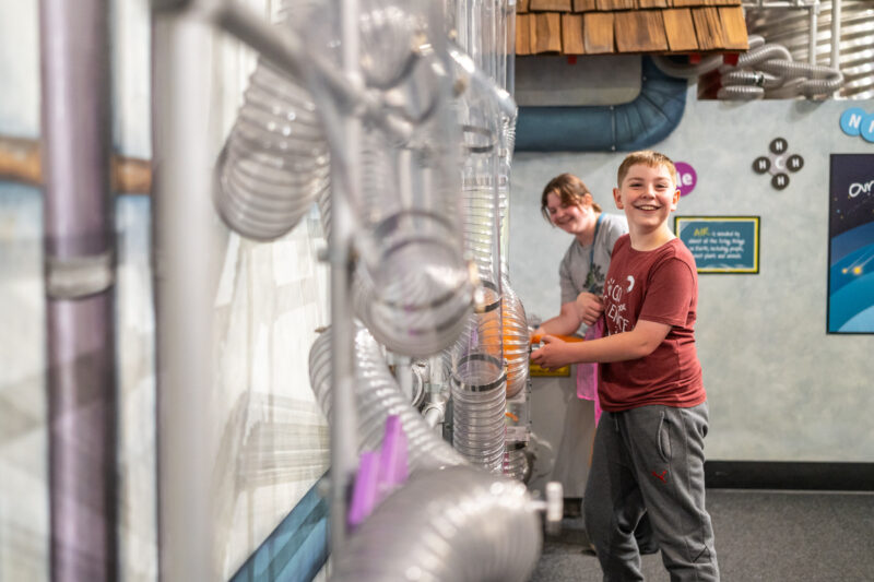 Little boy experiments with air movement at Imagine Chidrens Museum