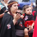Native American Woman passing on Salmon Ceremony traditions