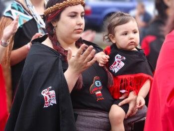 Native American Woman passing on Salmon Ceremony traditions
