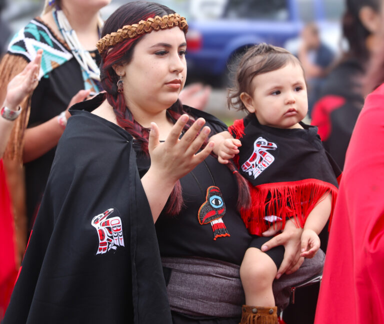 Native American Woman passing on Salmon Ceremony traditions