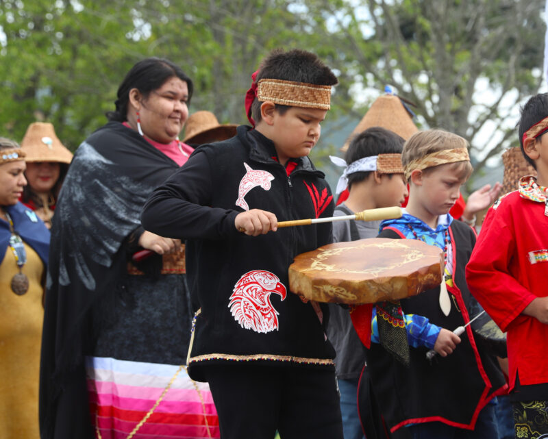 Native American drummer boys beat drums in Salmon Ceremony
