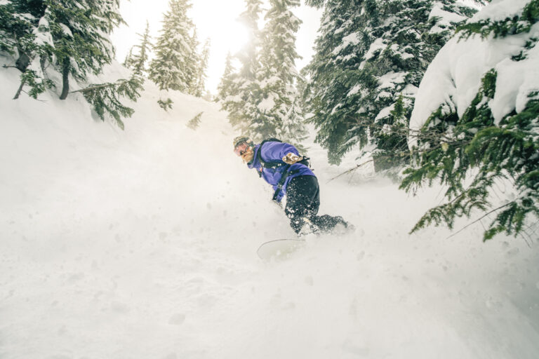 Snowboarding in powder at Stevens Pass