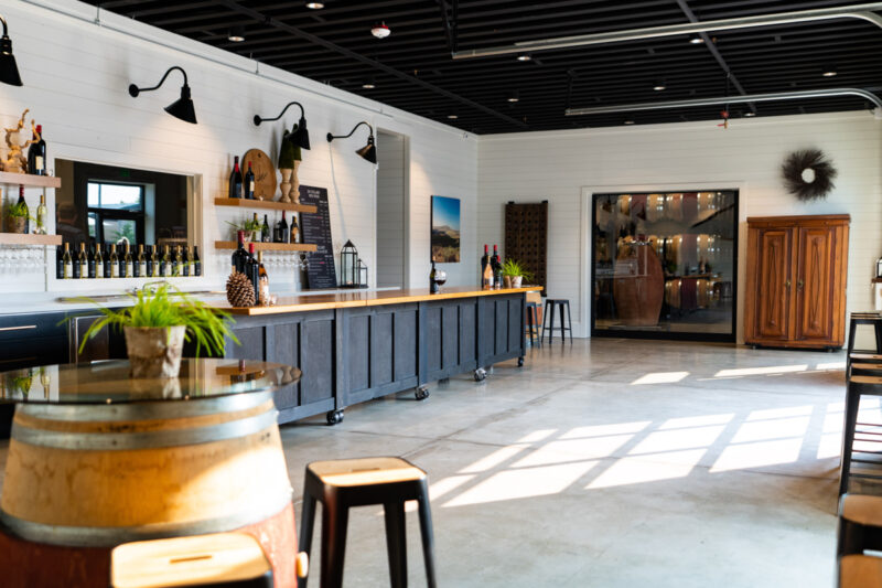 Wine tasing room with wine barrels at JM Cellars