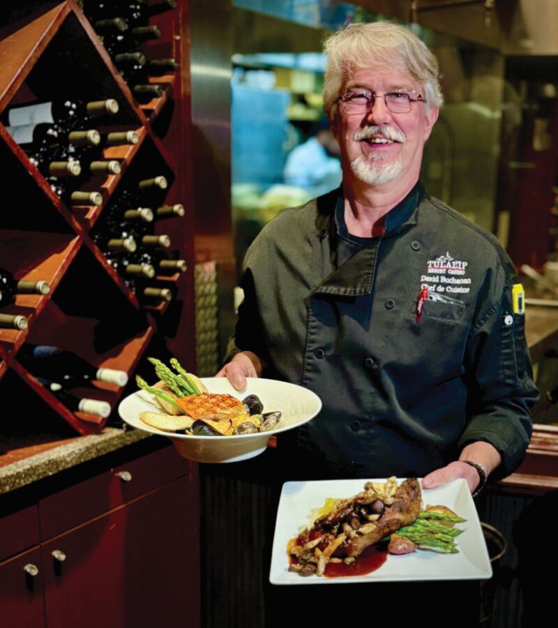 Black Fish Grill Chef with Plated Food