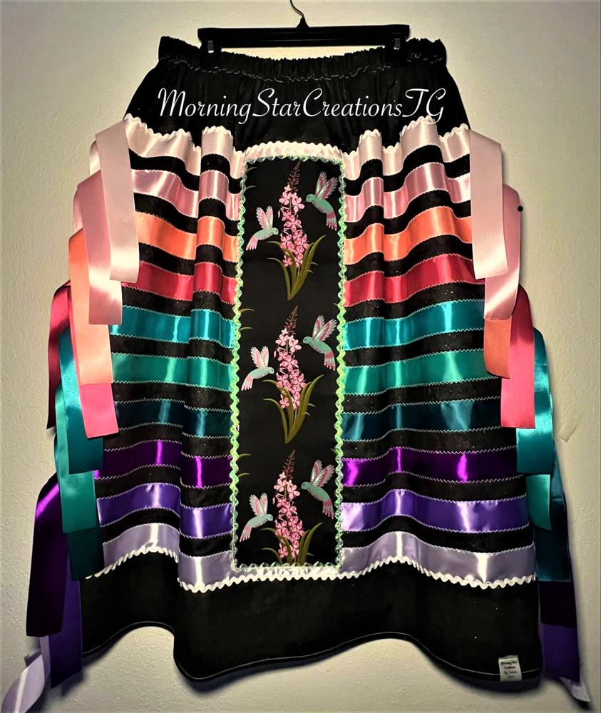 Skirt crafted using hummingbird panel flows to represent gracefulness of a hummingbird