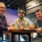 Tapped Millcreek 3 partners sitting at a table