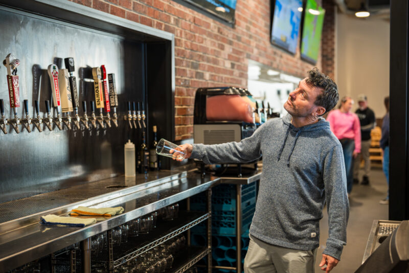 Tapped Millcreek Sean pouring a pint