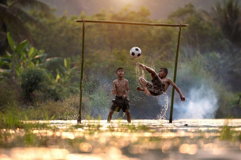 Children playing soccer in Vietnam Unsplash