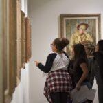 School tour group discuss about art