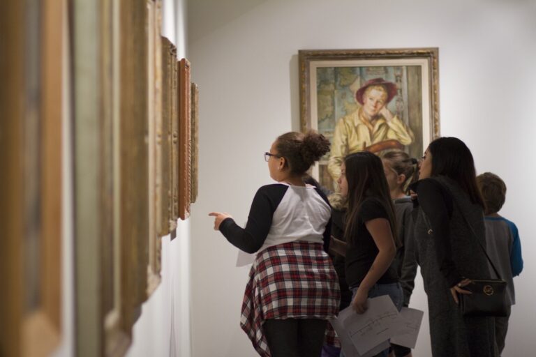 School tour group discuss about art