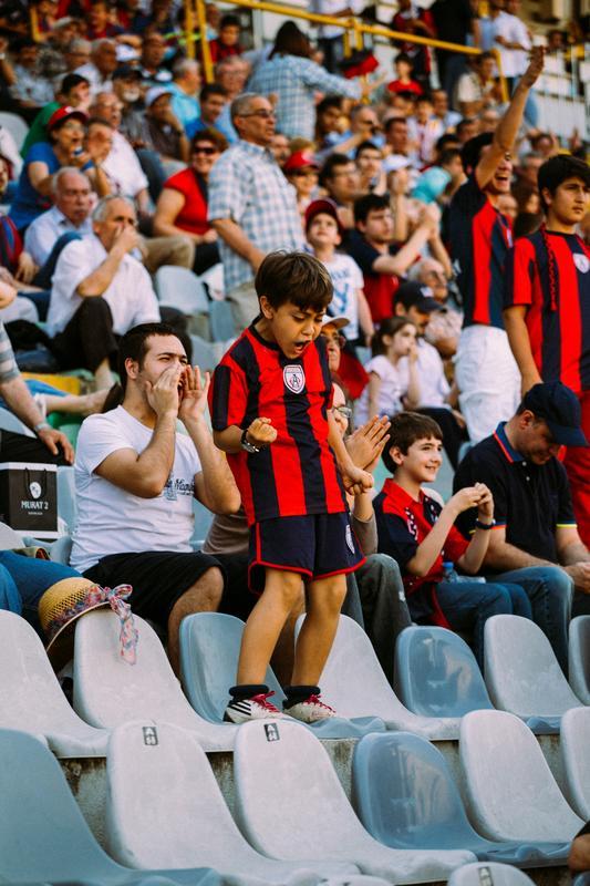 Soccer fans viewing game from stands
